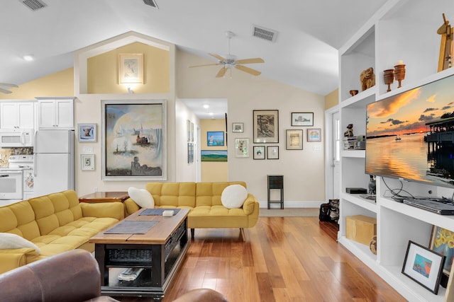 living room with vaulted ceiling, light hardwood / wood-style floors, and ceiling fan