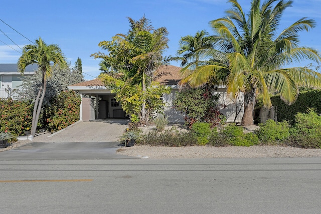 obstructed view of property with a carport