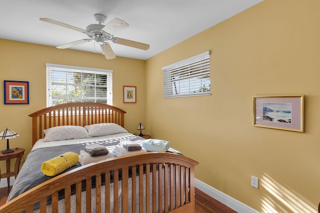 bedroom featuring ceiling fan and dark hardwood / wood-style floors