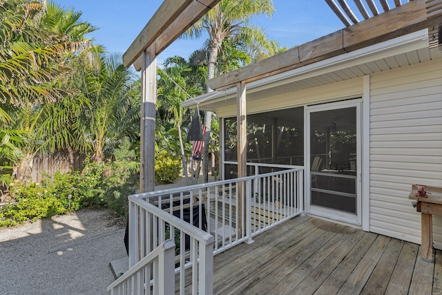 deck with a sunroom