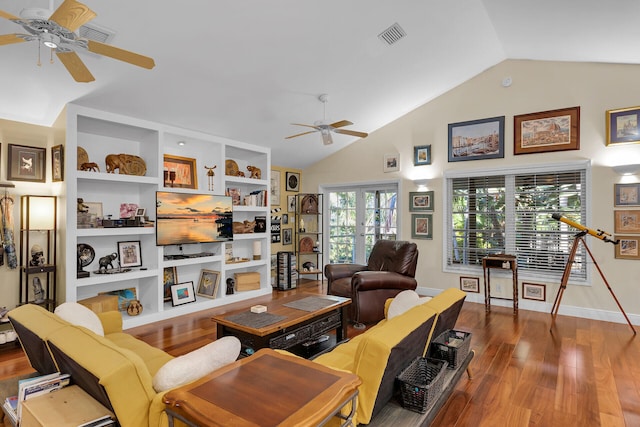 living room with hardwood / wood-style flooring, vaulted ceiling, ceiling fan, and french doors