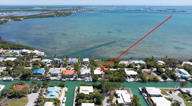 birds eye view of property with a residential view and a water view