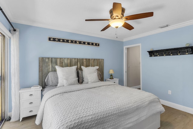 bedroom with ornamental molding, light hardwood / wood-style floors, and ceiling fan