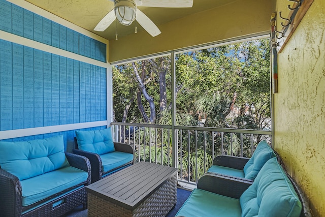 sunroom featuring ceiling fan