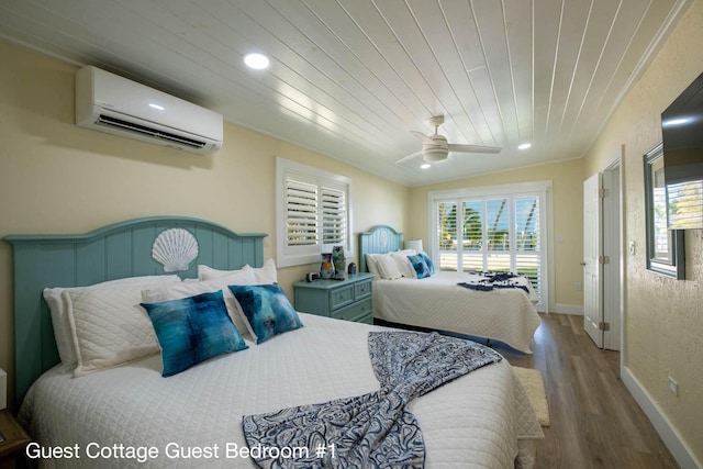 bedroom featuring hardwood / wood-style flooring, a wall mounted AC, wooden ceiling, and ceiling fan