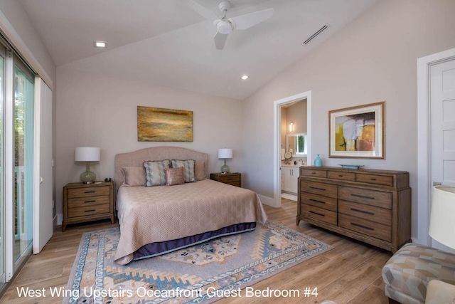 bedroom featuring lofted ceiling, light wood-style flooring, and visible vents