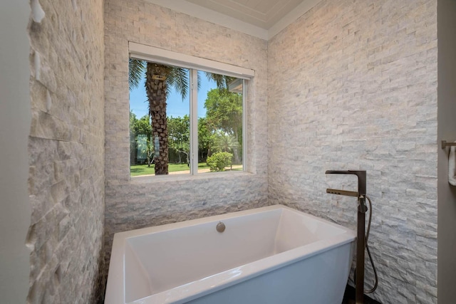 bathroom with a freestanding tub