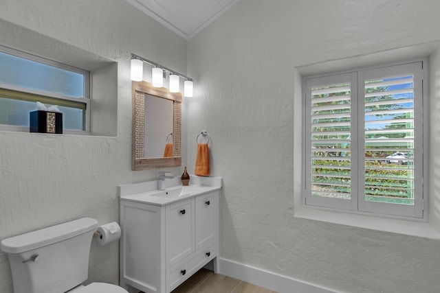 half bath with a wealth of natural light and a textured wall