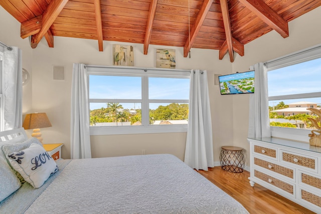 bedroom with multiple windows, wood ceiling, and lofted ceiling with beams