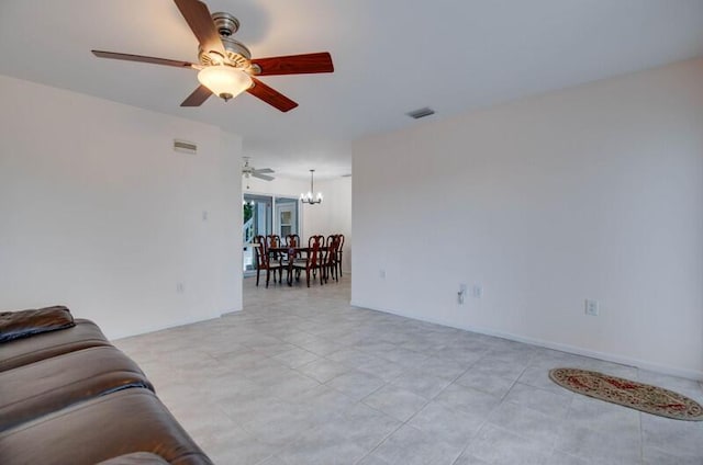 living area with visible vents and ceiling fan with notable chandelier