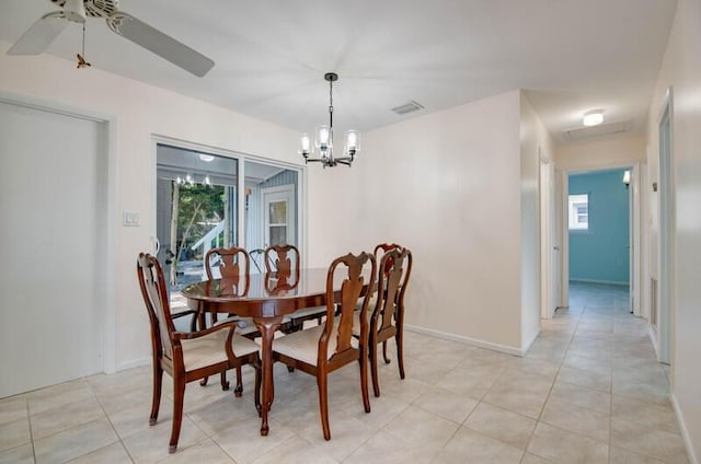 dining area featuring ceiling fan with notable chandelier, visible vents, a healthy amount of sunlight, and baseboards
