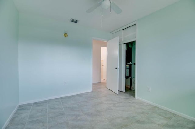 unfurnished bedroom featuring a closet, visible vents, ceiling fan, and baseboards