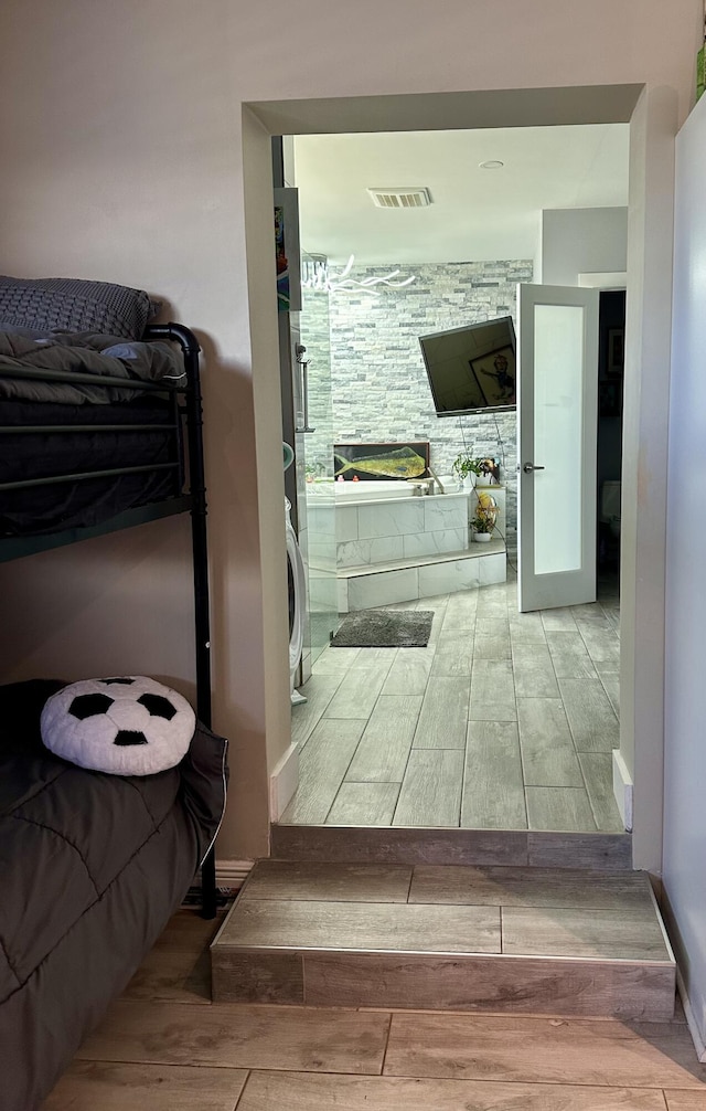 397 Balido St, Key West, FL 33040 - hall with wood finished floors and estacked washer and dryer