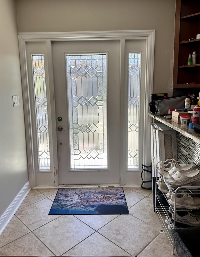 397 Balido St, Key West, FL 33040 - foyer featuring healthy amount of natural light, baseboards, and light tile patterned flooring