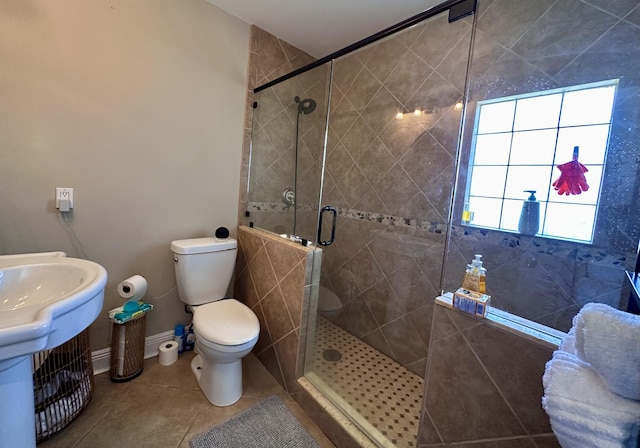 397 Balido St, Key West, FL 33040 - bathroom featuring a shower stall, tile patterned floors, toilet, and baseboards