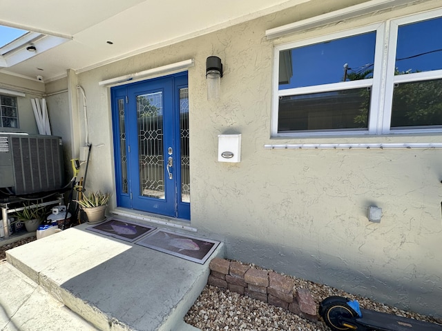 397 Balido St, Key West, FL 33040 - entrance to property with stucco siding and cooling unit