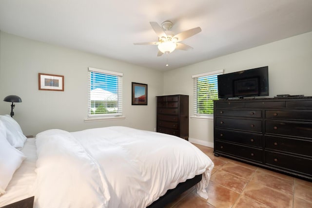 tiled bedroom with ceiling fan