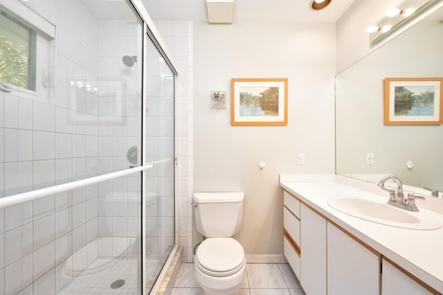 bathroom featuring vanity, toilet, and walk in shower