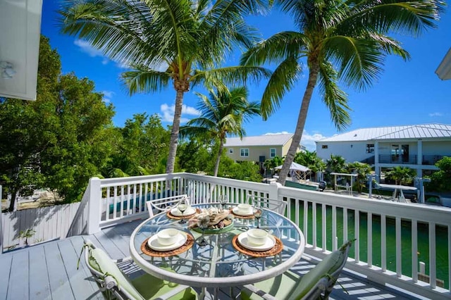 wooden deck featuring a yard