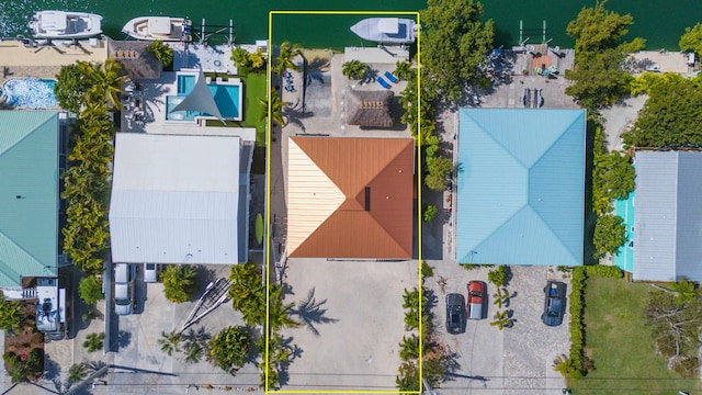 birds eye view of property with a water view