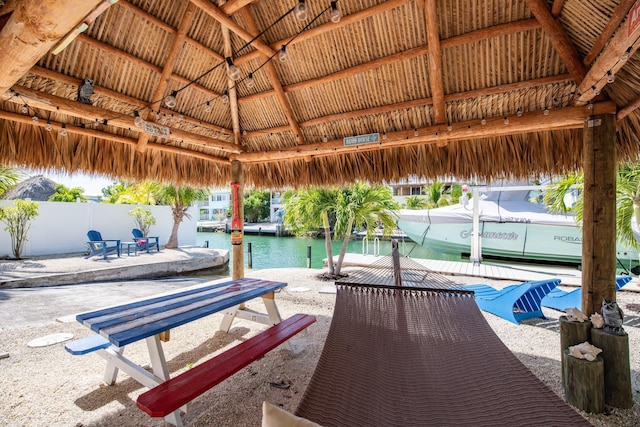 exterior space featuring a gazebo and a water view