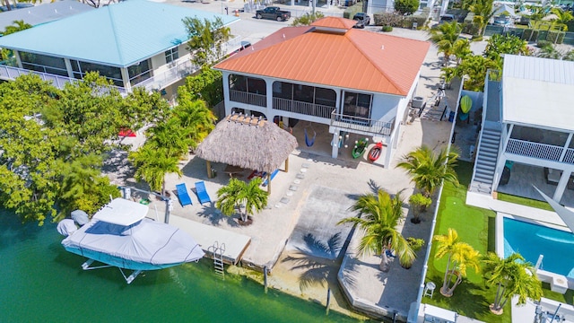 birds eye view of property featuring a water view