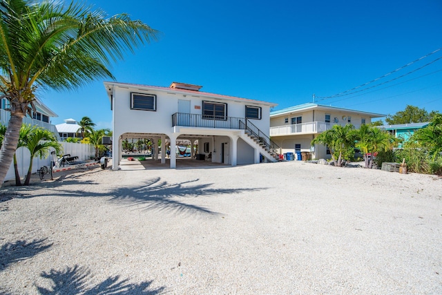 rear view of property featuring a carport