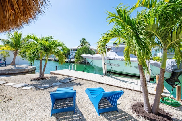 exterior space with a boat dock and a water view