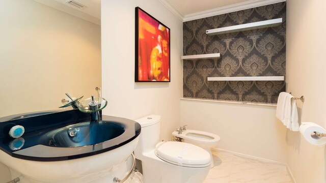 97501 Overseas Hwy Unit 809, Key Largo, FL 33037 - bathroom with marble finish flooring, a bidet, and ornamental molding