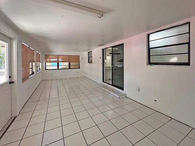 empty room with light tile patterned floors