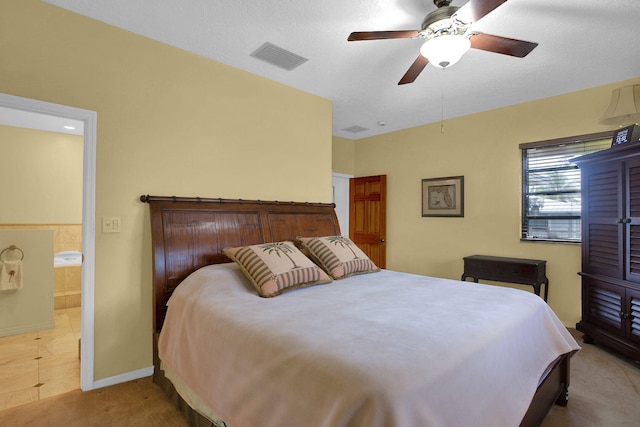 22865 Redfish Ln, Cudjoe, FL 33042 - bedroom featuring baseboards, ceiling fan, connected bathroom, and carpet flooring