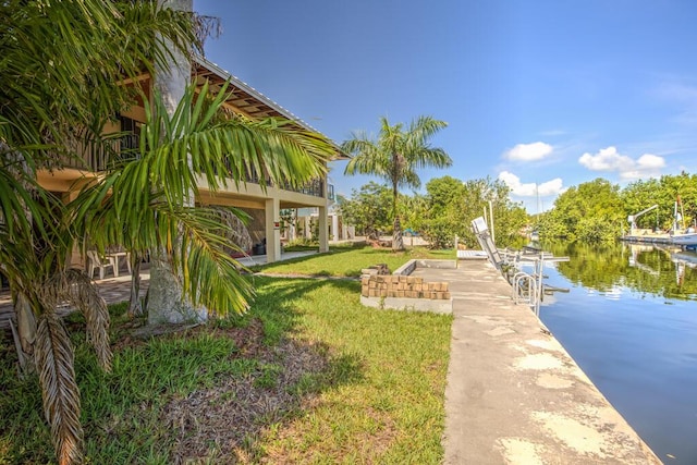 22865 Redfish Ln, Cudjoe, FL 33042 - dock area with a water view and a yard