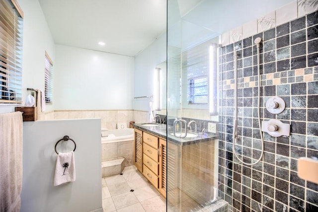 22865 Redfish Ln, Cudjoe, FL 33042 - bathroom with a garden tub, tile patterned flooring, a tile shower, double vanity, and recessed lighting