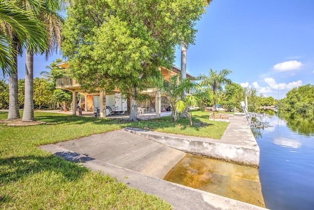 22865 Redfish Ln, Cudjoe, FL 33042 - view of community featuring a yard, a water view, and a dock