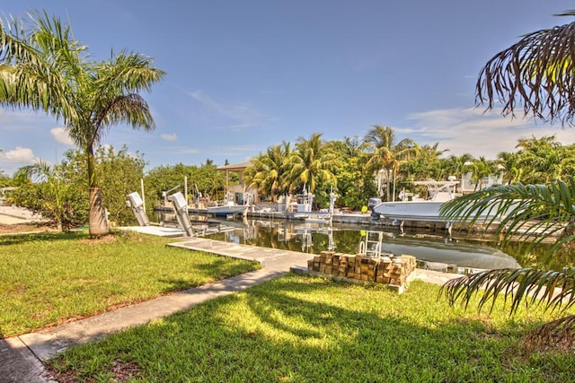 22865 Redfish Ln, Cudjoe, FL 33042 - view of community with boat lift, a boat dock, and a yard