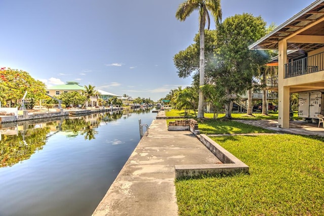 22865 Redfish Ln, Cudjoe, FL 33042 - dock area with a water view and a yard