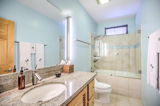22865 Redfish Ln, Cudjoe, FL 33042 - bathroom with tiled shower / bath combo, tile patterned floors, vanity, and toilet