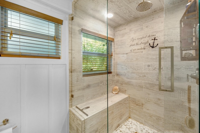 bathroom with a shower with shower door