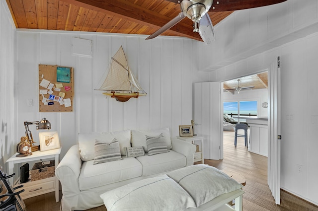 living room with beam ceiling, hardwood / wood-style floors, wooden ceiling, and ceiling fan