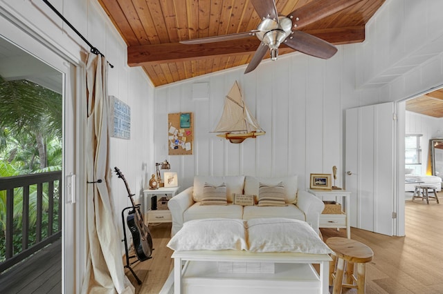 bedroom featuring beamed ceiling, wooden ceiling, and light wood-type flooring