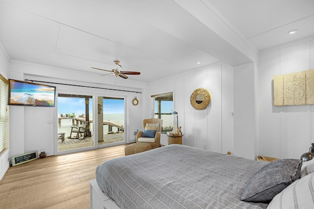 bedroom with hardwood / wood-style flooring, ornamental molding, access to outside, and ceiling fan