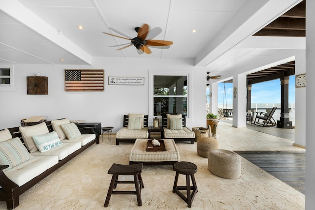 living room featuring hardwood / wood-style flooring and ceiling fan