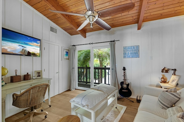 living room with beam ceiling, light hardwood / wood-style floors, and wooden ceiling