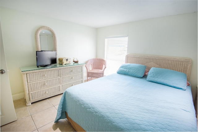 bedroom featuring light tile patterned flooring