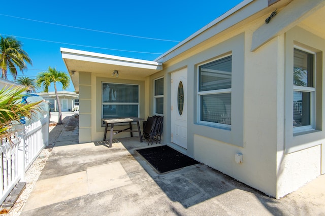 doorway to property with a patio