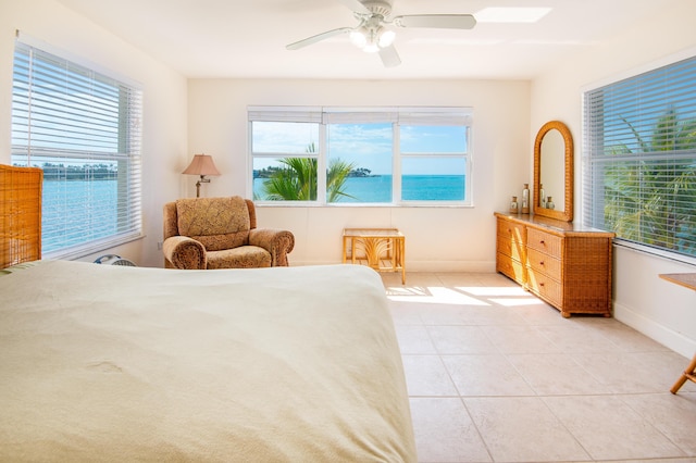 bedroom with light tile patterned flooring and ceiling fan