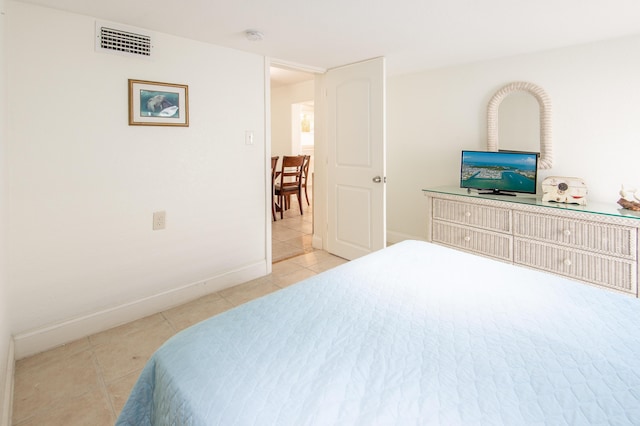 bedroom featuring light tile patterned flooring