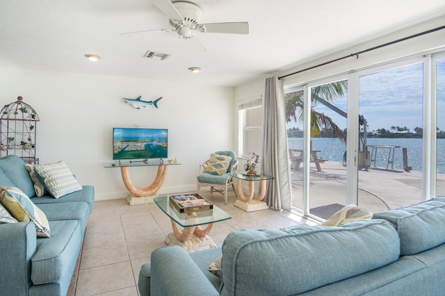 living room with light tile patterned floors and ceiling fan