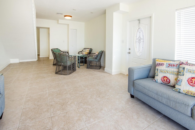 sitting room with light tile patterned floors