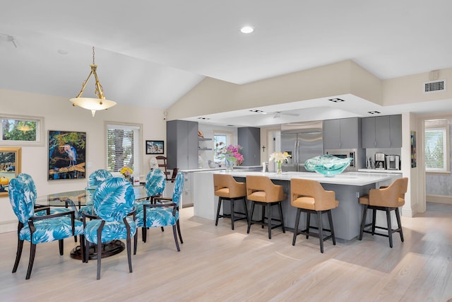3300 Riviera Dr, Key West, FL 33040 - dining room with light wood-style floors, plenty of natural light, vaulted ceiling, and recessed lighting